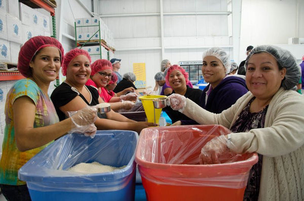 1/2 cup measure scoop in action. Feeding Children Everywhere.